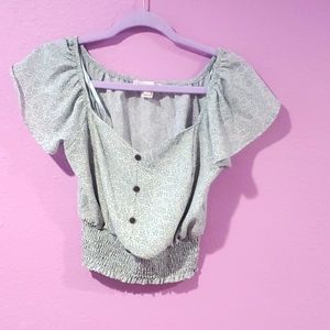 Women size medium floral tank top with scrunchy bottom and fake buttons